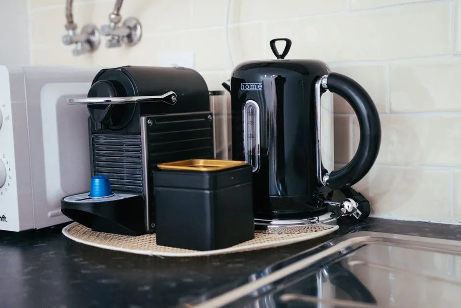 Coffee maker and kettle on a kitchen countertop, the kind of small appliance FixMyKitchenHQ indexes manuals for